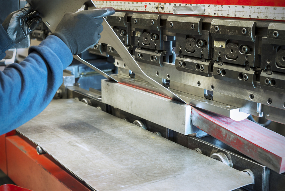 Industrial CNC press brake forming a metal enclosure panel
