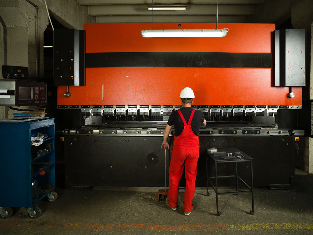 Industrial operator using a press brake for commercial vehicle parts
