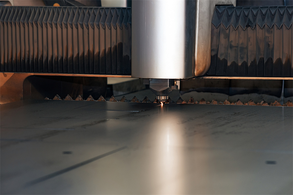 Industrial laser cutting machine processing metal plate